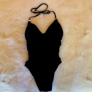 Victoria secret tummy control one piece. Fits amazingly and has push-up bra.